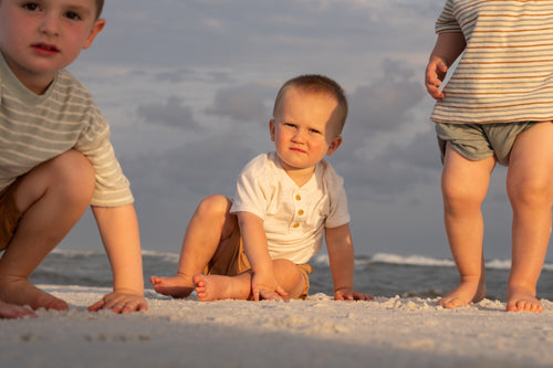 Toddler on the sand during a family beach session