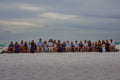Large extended family group on the beach